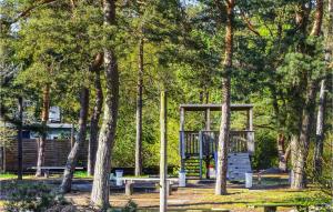 a park with a picnic shelter and trees at 1 Bedroom Stunning Home In Löderup in Löderup