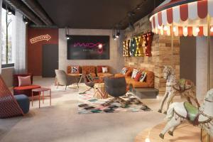 a rendering of a showroom with furniture and a lobby at Moxy Rust in Rust