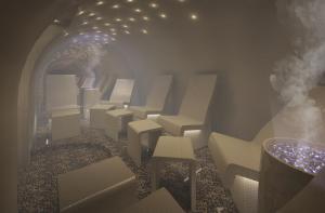 a room with white chairs and a tunnel at The Hotel Maria - Preferred Hotels & Resorts in Helsinki