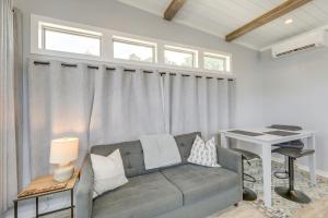 a living room with a couch and a table at Community Pool and Hot Tub Austin Tiny Home! in Austin