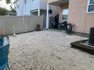 a backyard of a house with a fence at The Pelican’s Nest in Panama City Beach