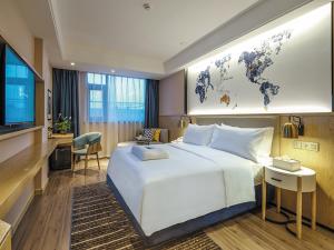 Гостиная зона в Kyriad Marvelous Hotel Suzhou Guanqian Street and Shiquan Street