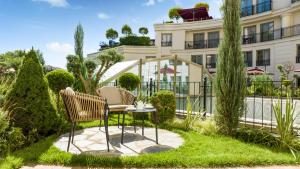 a table and chairs in front of a building at CVK Park Bosphorus Hotel Istanbul in Istanbul