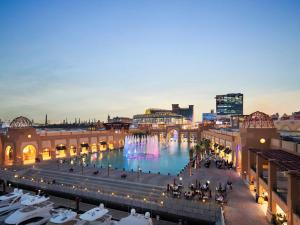 a view of a city with a fountain in a mall at Hyatt Regency Al Kout Mall in Kuwait