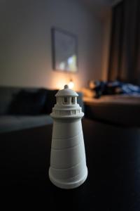 a white bottle sitting on top of a table at DP Apartments Vaasa in Vaasa