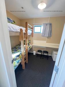 A bed or beds in a room at Stay Hostel Rotorua