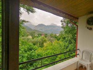 a window with a view of a mountain at Paşa Restaurant & Pansiyon in Kemer