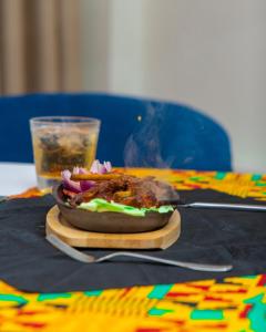 a sandwich on a cutting board on a table at Hotel Sapphire in Mombasa