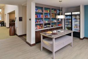 a pharmacy aisle with a counter in a store at Homewood Suites by Hilton Cincinnati/Mason in Mason