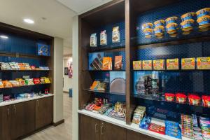 a store aisle with shelves of food and snacks at Hampton Inn & Suites - Knoxville Papermill Drive, TN in Knoxville