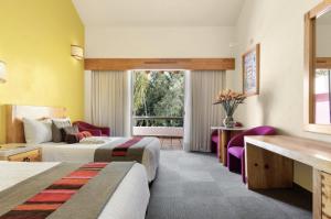 Cama ou camas em um quarto em Hotel Rancho San Diego Grand Spa Resort