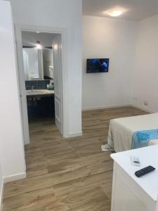 Televizors / izklaižu centrs naktsmītnē B&B Olbia City Center