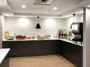 a kitchen with a counter with many items on it at Hampton Inn Philadelphia/King of Prussia - Valley Forge in King of Prussia