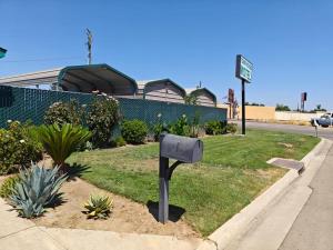 a mailbox sitting on the side of a street at Town House Motel in Sanger