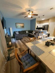 a kitchen and living room with a table and chairs at McDrifty's Getaway in Panama City Beach