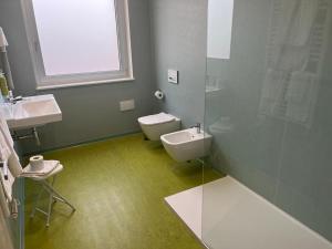 a bathroom with a toilet and a sink at Grand Hotel Lamezia in Lamezia Terme