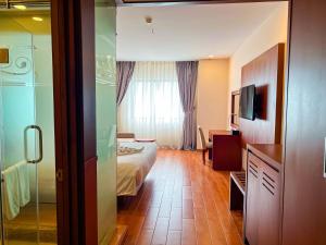 A bed or beds in a room at Galina Hotel & Spa