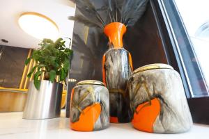 a group of vases sitting on a table at Riva Hotel Alsancak in İzmir