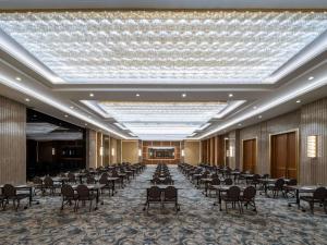 a large banquet hall with tables and chairs at Sofitel Istanbul Taksim in Istanbul