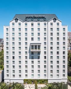 a white building with a sign on top of it at Four Seasons Hotel Buenos Aires in Buenos Aires