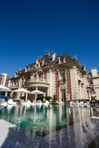 a large building with a fountain in front of it at Four Seasons Hotel Buenos Aires in Buenos Aires