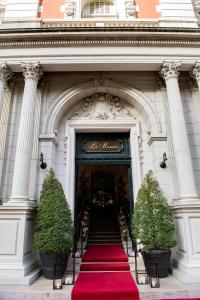 a red carpeted staircase leading to an entrance to a building at Four Seasons Hotel Buenos Aires in Buenos Aires