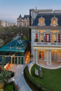 a large white house with at Four Seasons Hotel Buenos Aires in Buenos Aires