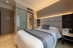 Katil atau katil-katil dalam bilik di Habitus Hotel Europa