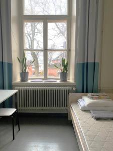 מיטה או מיטות בחדר ב-Hostel Suomenlinna