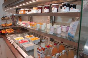 a refrigerator filled with lots of food and drinks at K Hotel in Strasbourg