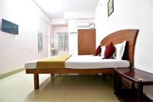 เตียงในห้องที่ Royal Green Accommodation Chennai Airport