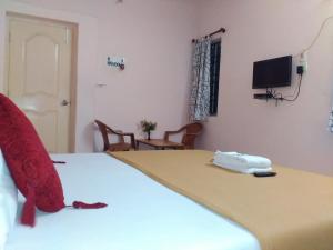 เตียงในห้องที่ Royal Green Accommodation Chennai Airport