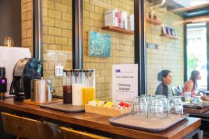 a counter with some drinks and glasses on it at Parkavenue Guesthouse in Seoul