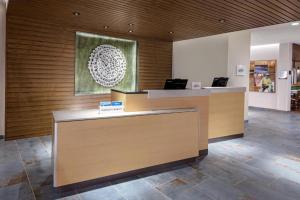 an office with a reception desk with two laptops at Fairfield by Marriott Port Clinton Waterfront in Port Clinton