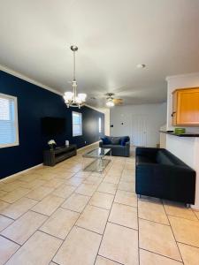 a living room with a couch and a table at 3BR King Suite/Near Strip/Wi-Fi in Las Vegas