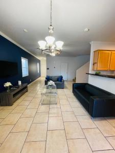 a living room with a couch and a table at 3BR King Suite/Near Strip/Wi-Fi in Las Vegas