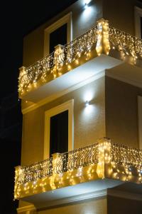 a group of lights on the side of a building at Domea Superior Rooms Bed and Breakfast in Reggio di Calabria