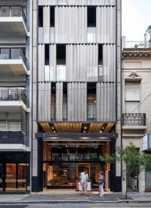 a group of people standing outside of a building at AQ Tailored Suites in Buenos Aires