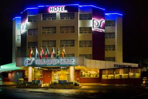 a hotel building with blue lights in front of it at Hotel Parque Satelite in Mexico City