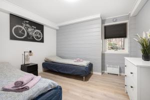 Ліжко або ліжка в номері Apartments Bergen free parking