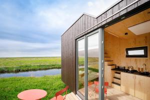 Casa con vistas al río en Tiny House Nature 14 Zur Meerseite - Green Tiny Village Harlesiel, en Carolinensiel