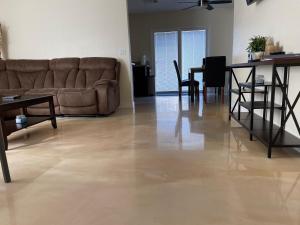 a living room with a couch and a table at Newly Remodeled Family Friendly 3B/2B House in Henderson