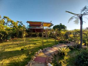 a garden with a building in the background at K'Ho Cil Homestay Tà Nung in Da Lat