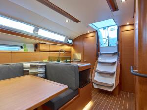 a kitchen and dining room on a yacht at Sleep aboard a modern sailboat in Oeiras in Oeiras