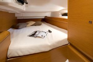 a bed in the back of a boat at Sleep aboard a modern sailboat in Oeiras in Oeiras