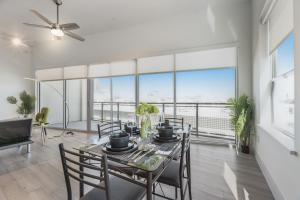 a dining room with a table and chairs at Contemporary 2BR I Gym I Parking I Workspace in Dallas