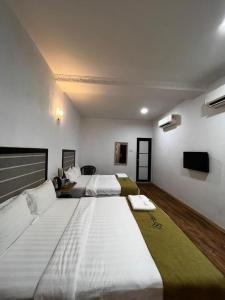 A bed or beds in a room at S8 Boutique Hotel near KLIA 1 & KLIA 2