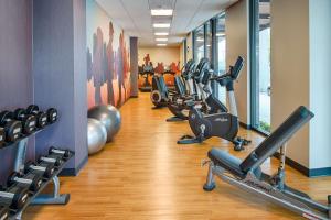 a gym with several treadmills and exercise bikes at Hyatt House Seattle Downtown in Seattle