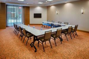 a large conference room with a long table and chairs at Hyatt House Seattle Downtown in Seattle