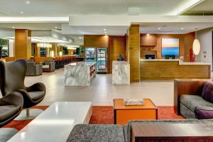 a lobby of a hotel with couches and chairs at Hyatt House Seattle Downtown in Seattle